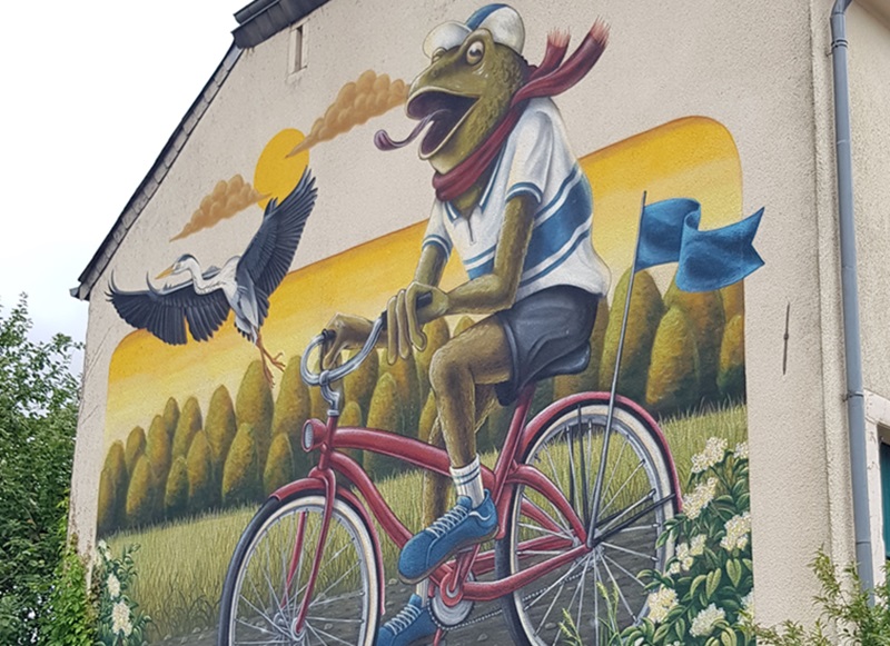 Koler street art Kikker op een fiets